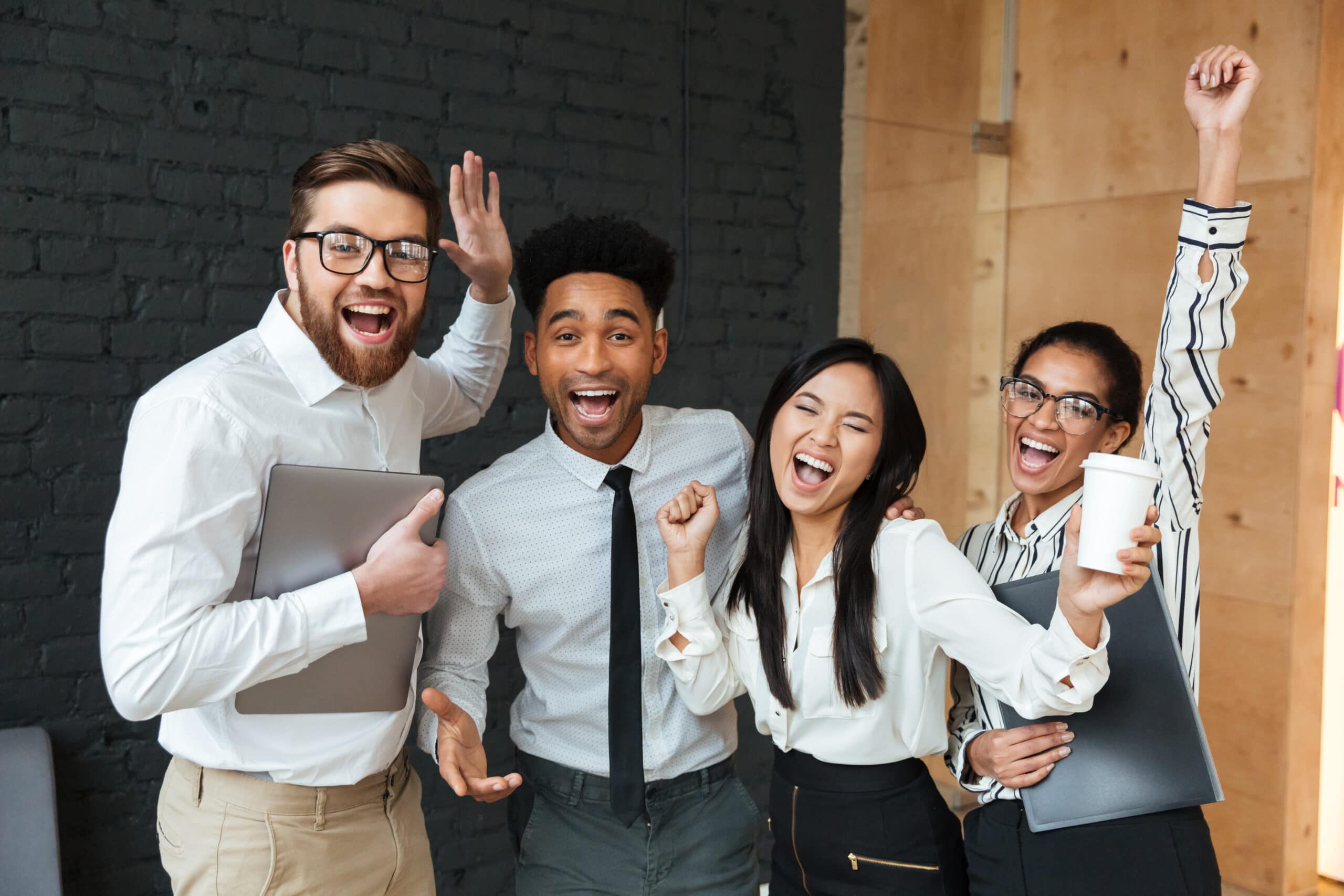 Happy business colleagues celebrating successful Microsoft Access billing system conversion.